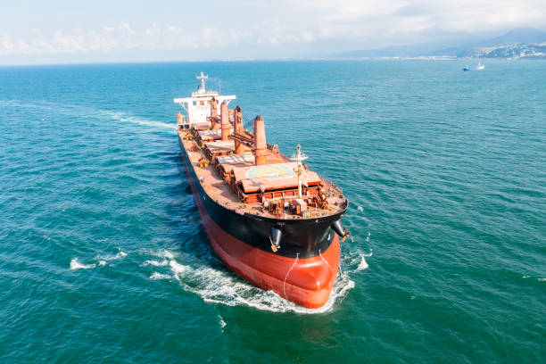 istock Aerial view of cargo ship in transit. 1327996960