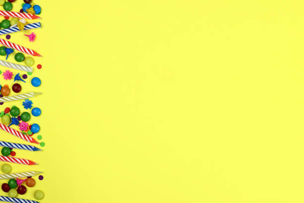 istock Festive background with birthday decor. Candles, candies and confetti 1327997491