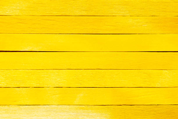 Yellow color wood plank use as textured background, frame, decoration with copy space