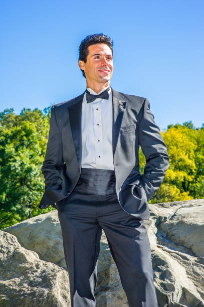 istock Portrait of mid aged businessman standing outdoors, looking forward 1328003119