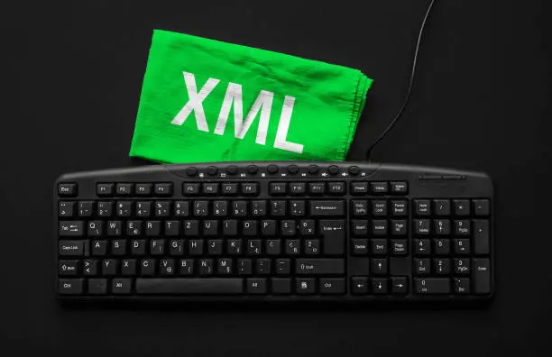 Photo of Rag width word XML and pc keyboard.