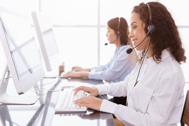 istock Callcenter people working calling for helpdesk hotline or Telesale agent, Customer support happy working with smile in office. 1328007996