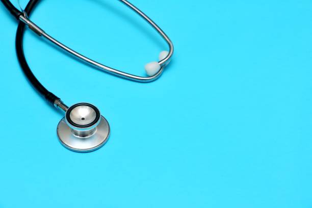 istock A stethoscope  on a blue background -medical background  theme 1328011414