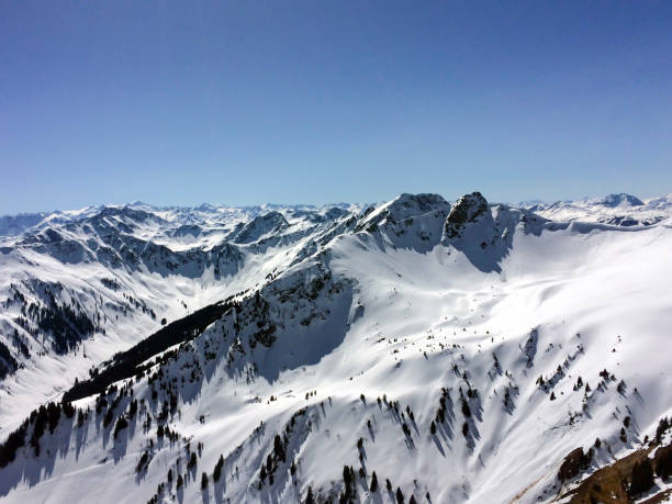 istock Winter snow covered mountain peaks in Austrian alps. 1328015191