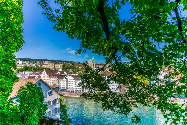 View of Zurich and the Limmat river icoming back to life after the lock-down View of Zurich and the Limmat river icoming back to life after the lock-down switzerland zurich architecture church stock pictures, royalty-free photos & images