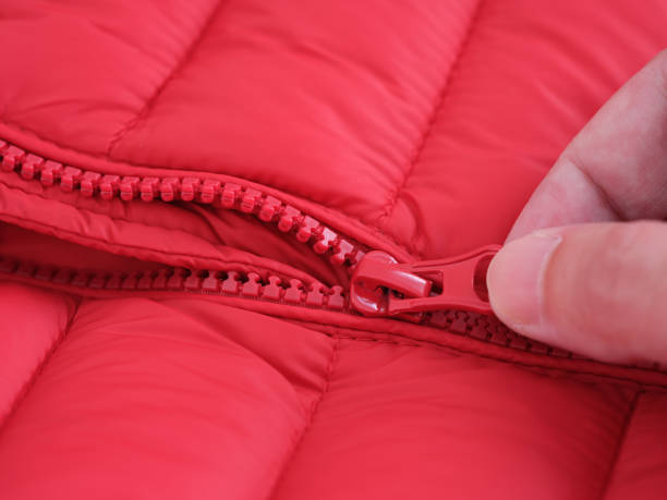 istock Close-up shot of a zipper on a red jacket 1328016241