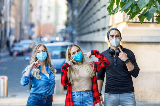 istock A Group of Students Are Walking Down the City District with Protective Face Masks. 1328018966