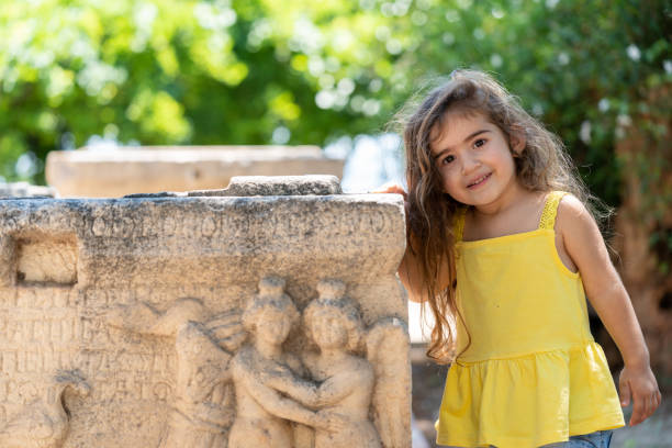 istock Toddler Girl Exploring Ancient Architecture In Outdoor 1328020980