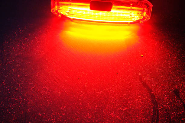 istock Red light standing on metal surface that is covered by dust and light reflection on the surface. 1328021143