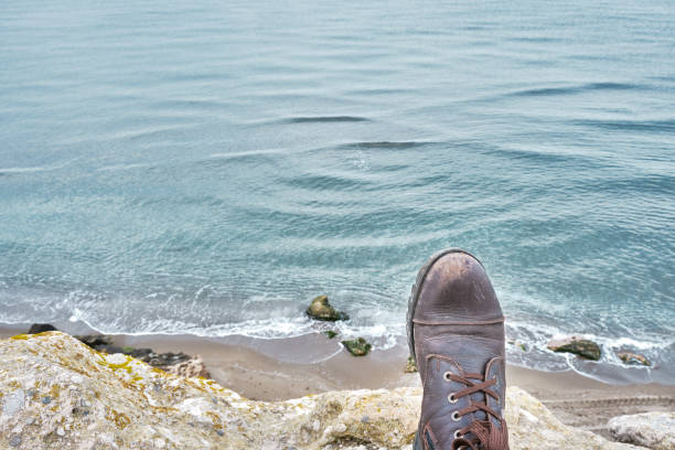 Brown, vintage and old boot with magnificent clean sea background from the photo taken from hill besides the Marmara sea.