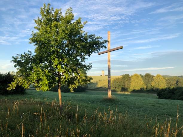 istock A cross in a idyllic landscape 1328025806