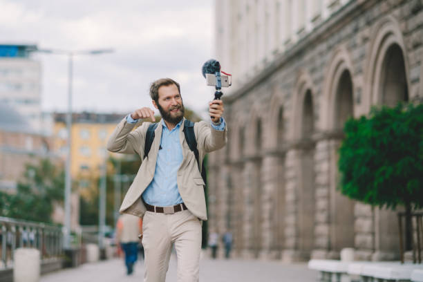 istock Businessman vlogging on business trip 1328026409