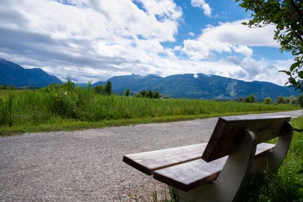 istock View into the Murnauer Moos at the Staffelsee with footpath and bench in the foreground, cloudy sky 1328029094