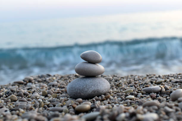istock stacked stones with sea background 1328034935