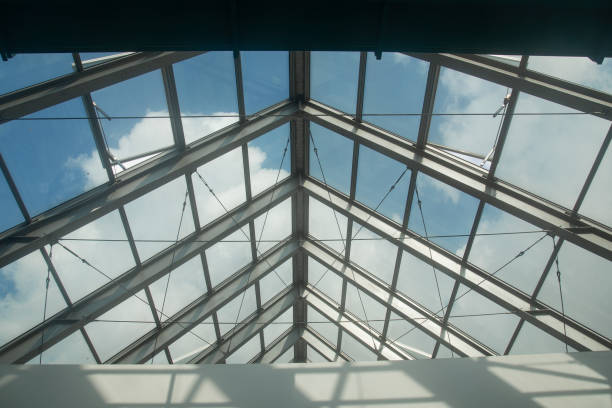 Modern steel structure with glass walls has a beautiful curved design.