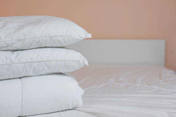 istock neat stack of bedding pillows and a duvet lie on the bed 1328038067