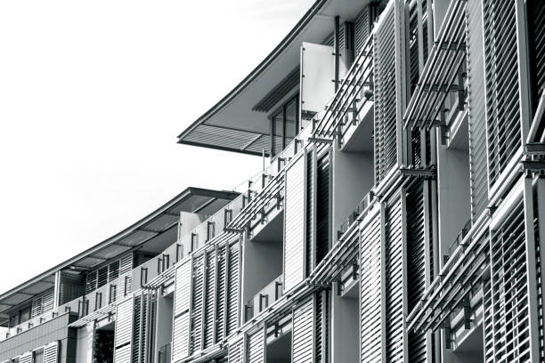 istock Black and white modern apartment buildings, white background with copy space 1328044736