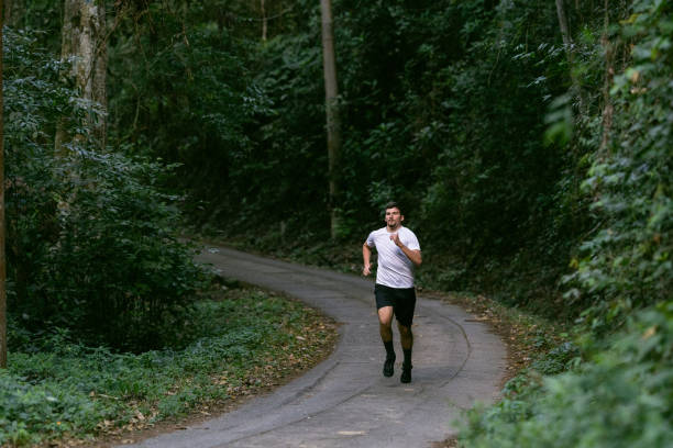 istock Young athlete running in the national park 1328048672