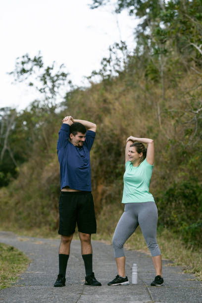 istock Athletes couple stretching in the natural park 1328048763