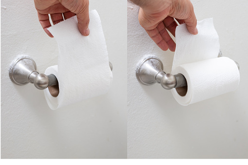 A set of two photos demonstrating toilet paper orientation, portraying a hand holding the sheet in both directions.