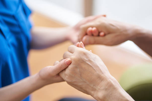 Hands of caregivers and the elderly