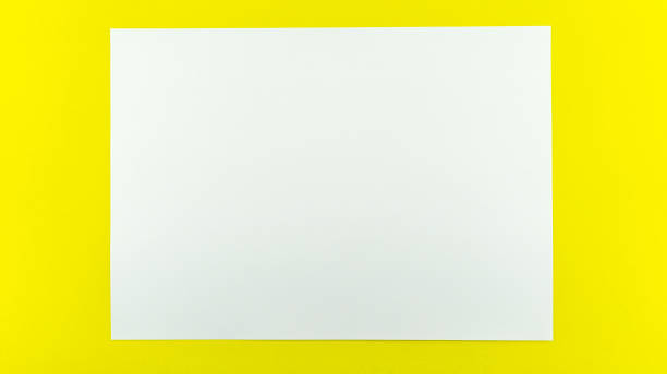 istock White sheet paper on yellow paper background copy space for your text advertising 1328060584