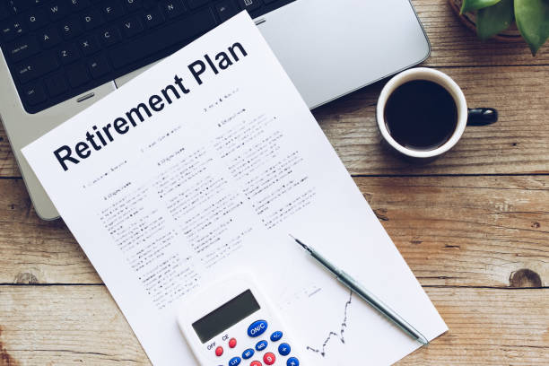 istock Retirement Plan. Calculator, pen and notebook on wooden table 1328061587