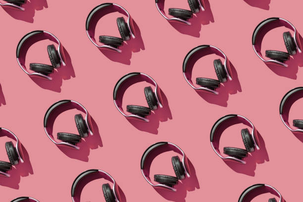 istock Many same headphones on bright background. Modern music concept 1328061613