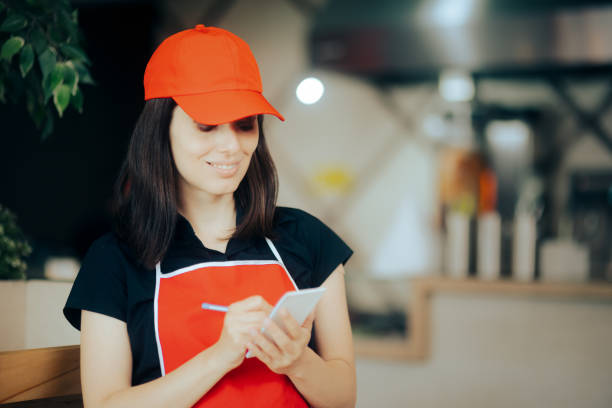 istock Happy Waitress Taking Food Order Working in a Restaurant 1328064150