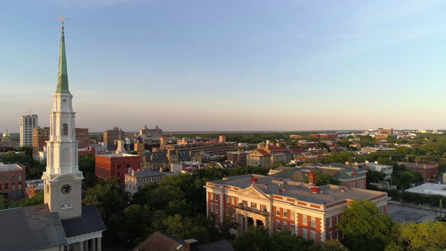 Panoramic aerial view of the Historic District in Downtown Savannah, Georgia, with  Independent Presbyterian Church in the foreground, in the evening before sunset.