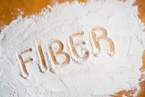 Word fiber written on a wooden table with flour. stock photo