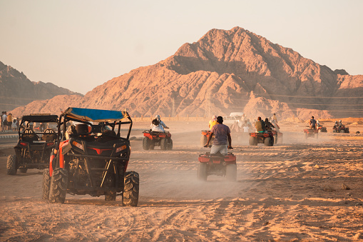 An off-road vehicle in a beautiful and savage desert landscapes north of Tabuk in Saudi Arabia