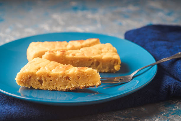 Squash and cheese cake on a plate on a blue cloth stock photo