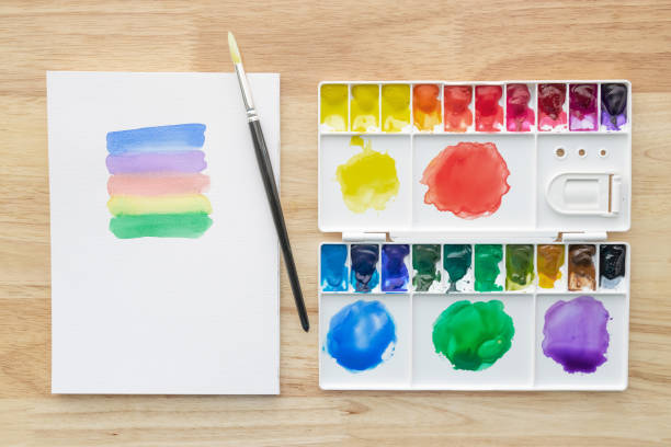 istock Watercolor paints set with white paper. 1328080603