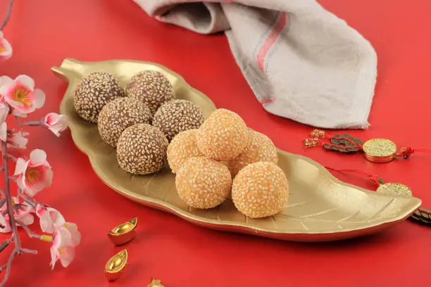 Onde-onde or Glutinous Rice Sesame Seed Ball, Served on Indonesian Traditional Style Bali Plate. Close Up. Popular Indonesian Snack with Chinese Influence. Cap Go Meh Style