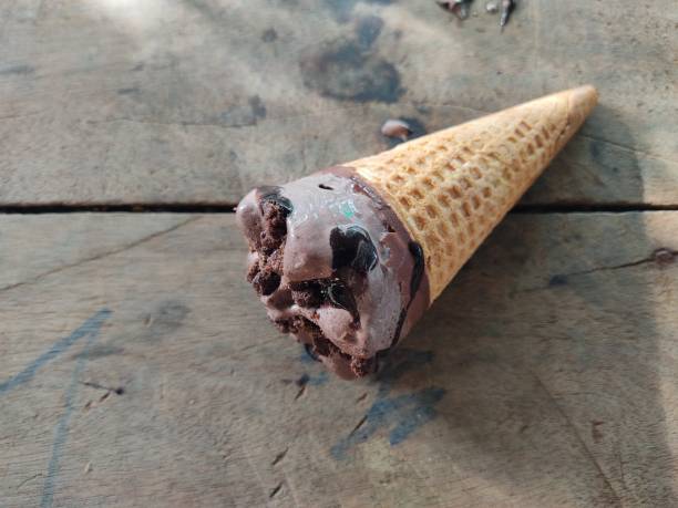 istock Chocolate ice cream cone, a stick on a hot day, 1328084352