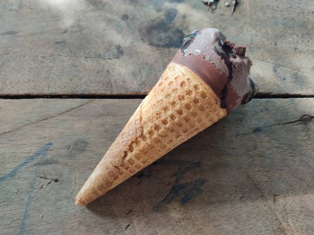 istock Chocolate ice cream cone, a stick on a hot day, 1328084353