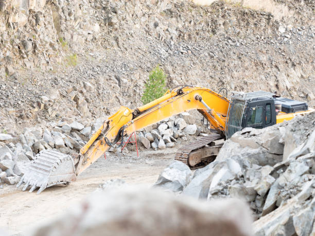 istock Excavator during earthmoving work at open-pit mining on gravel quarry 1328089338