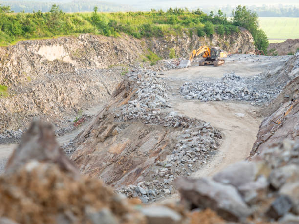 istock Excavator during earthmoving work at open-pit mining on gravel quarry 1328090017