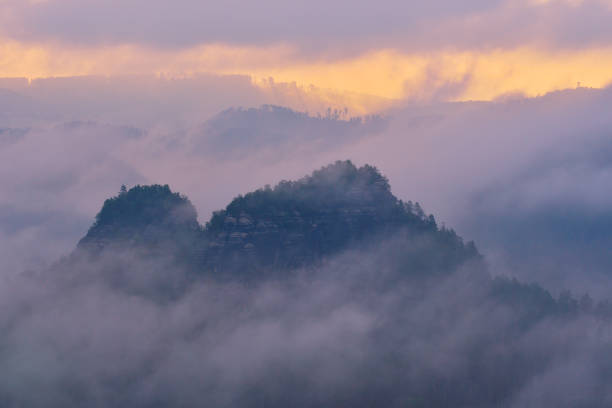 Morning after heavy rainy night. Misty clouds in valley. Morning after heavy rainy night. Misty clouds in valley. Foggy forest during sunrise, Saxon Switzerland, Germany. winterberg photos stock pictures, royalty-free photos & images