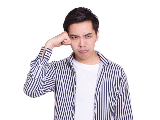 istock The handsome young man with  anxious and annoyed expression, touched his head 1328092106