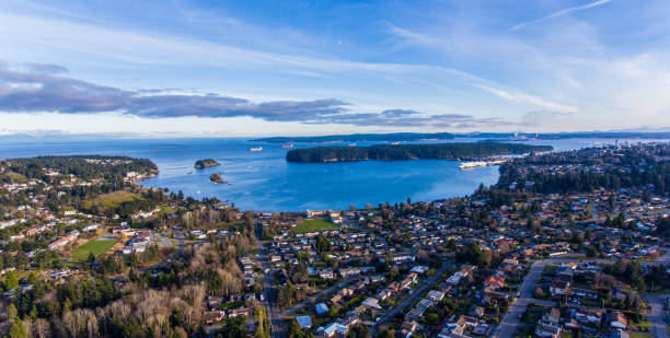 Departure Bay - Nanaimo BC A blue bird day in Nanaimo in this aerial shot taken above the desirable neighbourhood of Departure Bay. vancouver island photos stock pictures, royalty-free photos & images