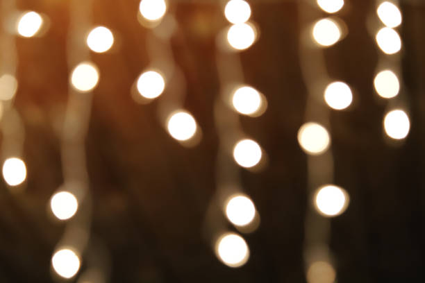istock Strings of blurred white holiday lights as a background 1328094342