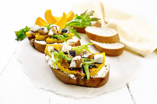 istock Bruschetta with pumpkin and sauce on white board 1328099786