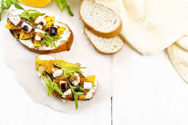 istock Bruschetta with pumpkin and sauce on board top 1328099787