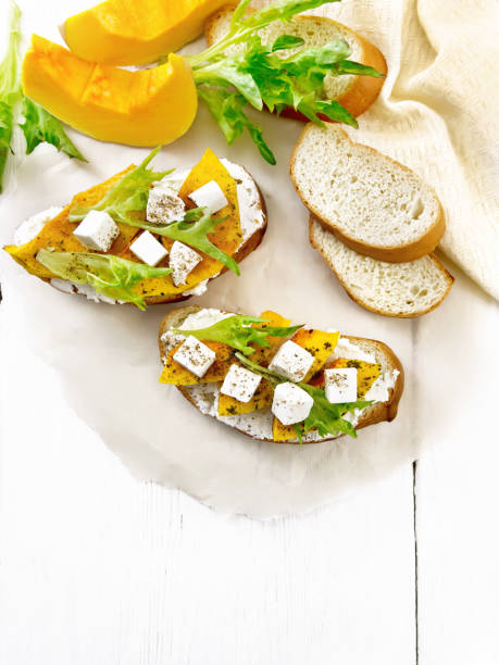 istock Bruschetta with pumpkin and ricotta on board top 1328099788