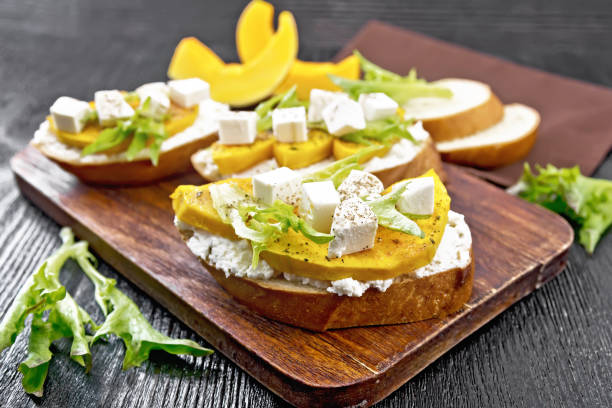 istock Bruschetta with pumpkin and arugula on board 1328099794