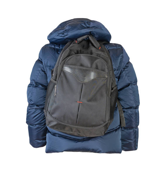 istock black backpack dressed in a red jacket isolated on a white background. 1328106693