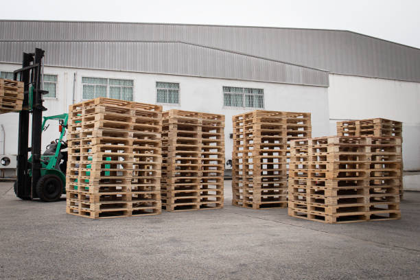 istock Stack of Wooden Pallets Rack at Storage Warehouse. 1328108058