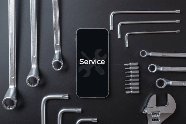 istock Mobile repair service. Technician workplace with phone and special repairing tools. Electronics repair service, device production concept. 1328108272